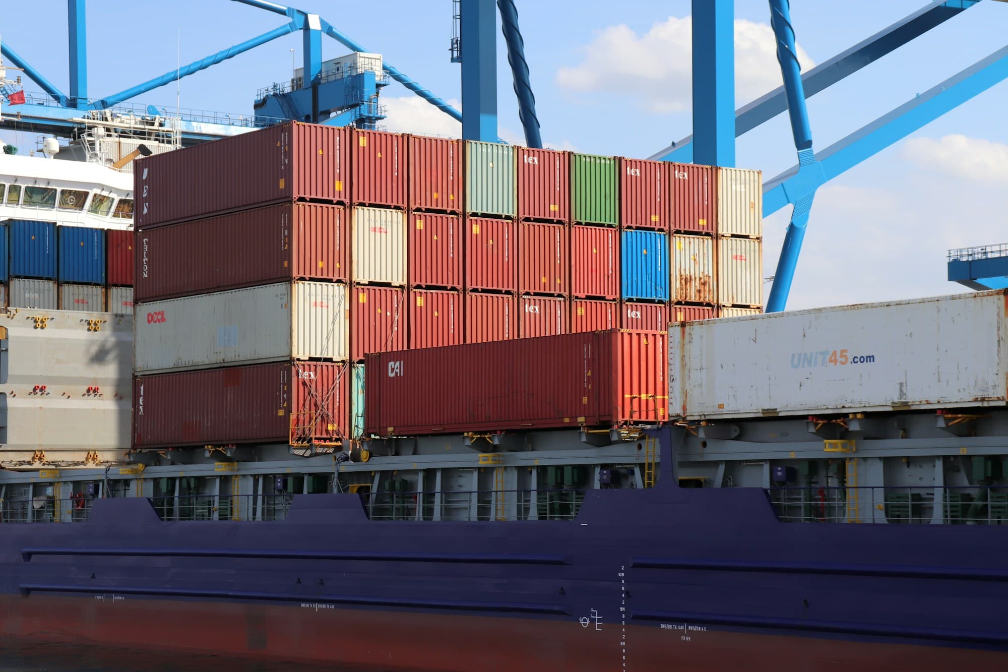 Containers aboard a vessel at a terminal